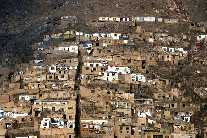 Rows of houses sloping down a mountain in Afghanistan.